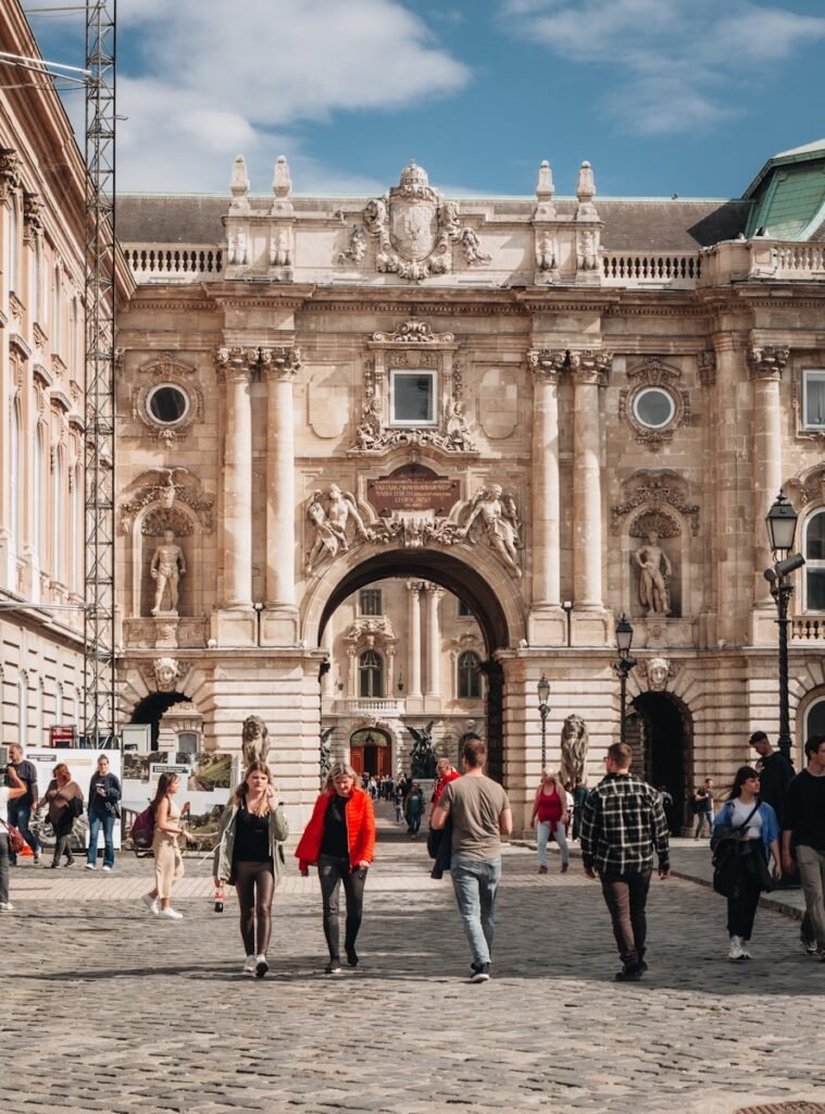 a group of people walking in front of a building