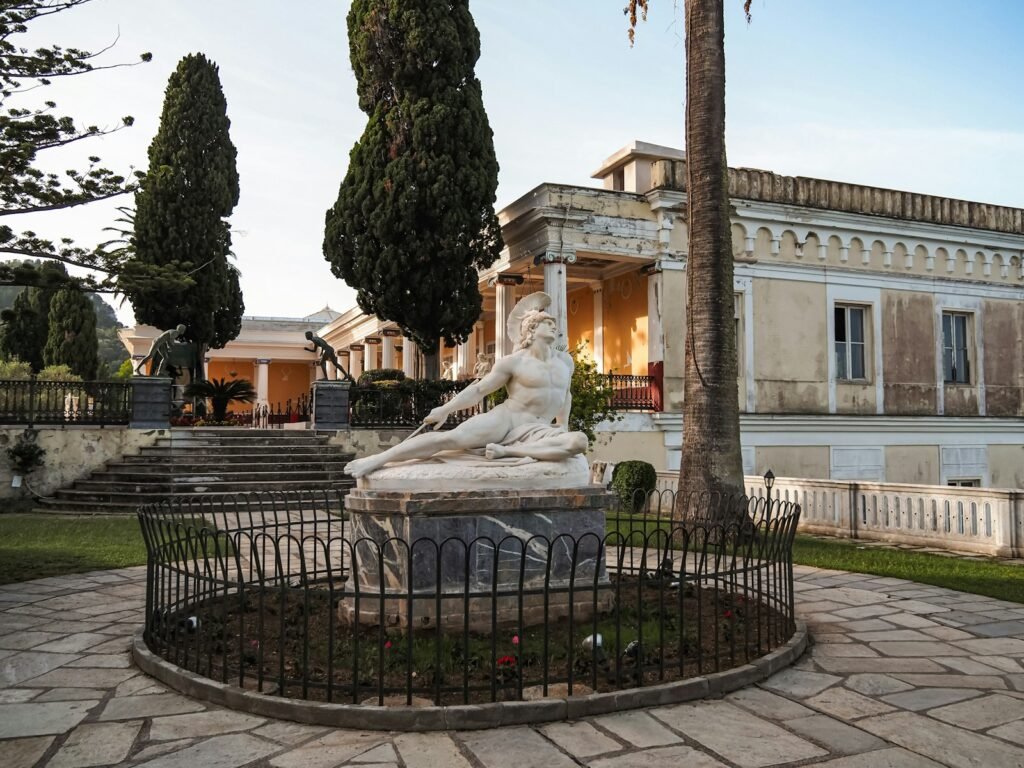 A statue of a woman sitting on top of a fountain