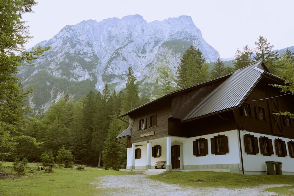 a house with a mountain in the background