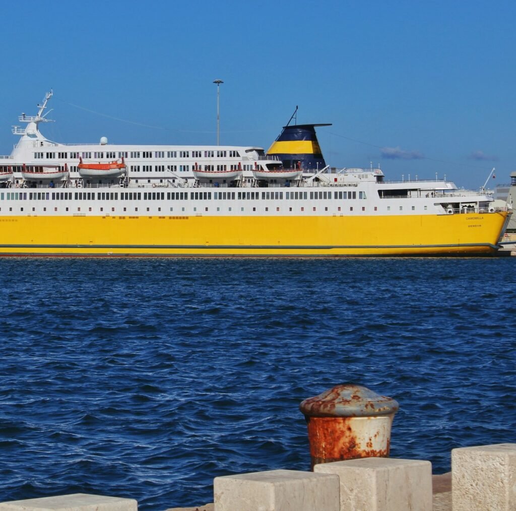 a large white and yellow boat in the water