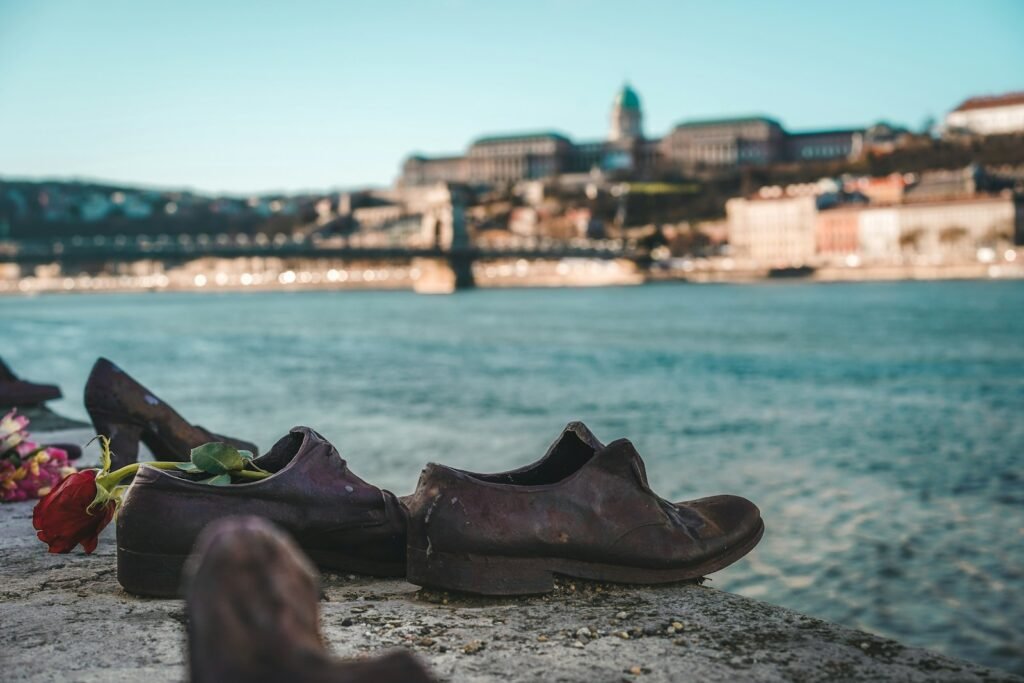 a couple of shoes that are sitting on a ledge