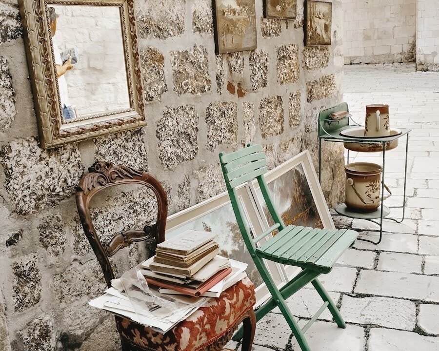 Chairs near Stone Wall with Paintings