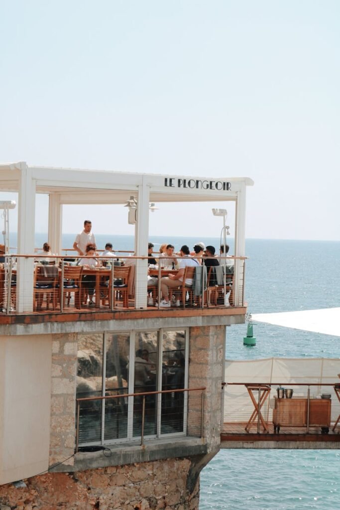 People on Restauran Terrace on Sea Shore