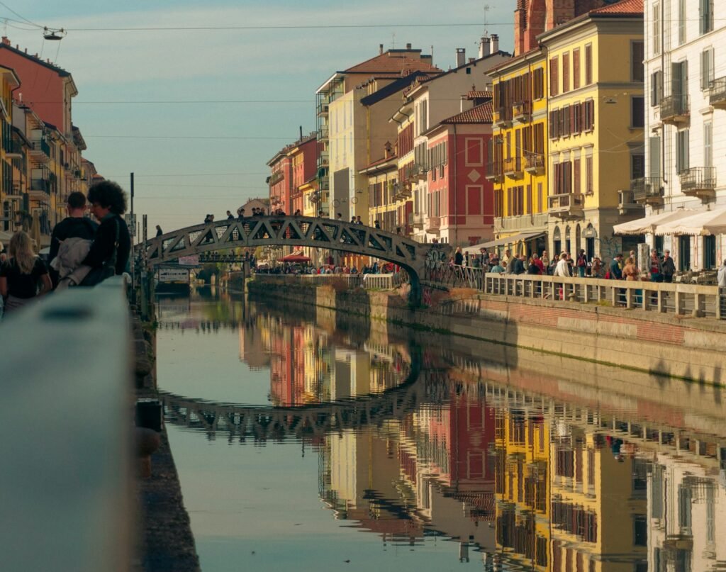 a bridge over a body of water with buildings around it