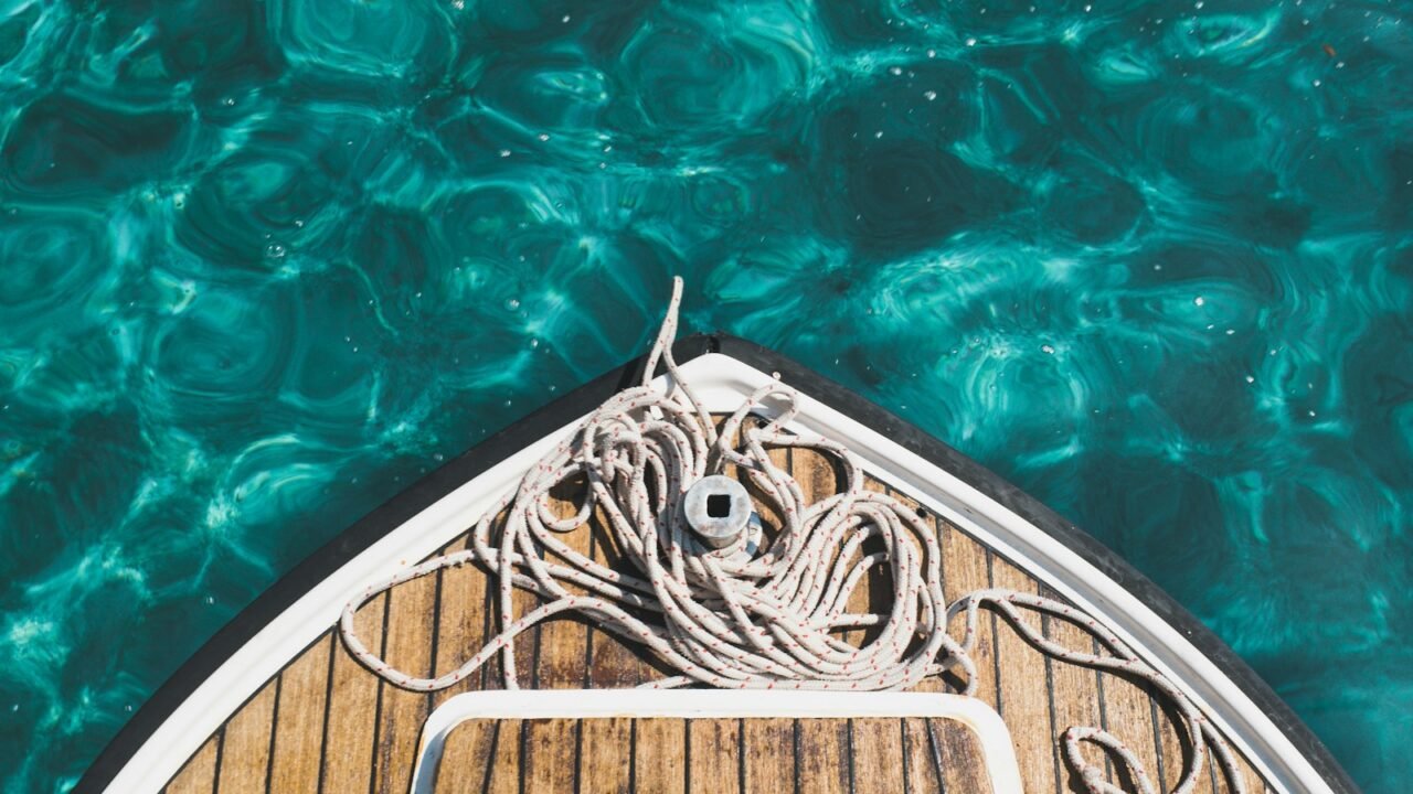 aerial photography of brown boat on body of water