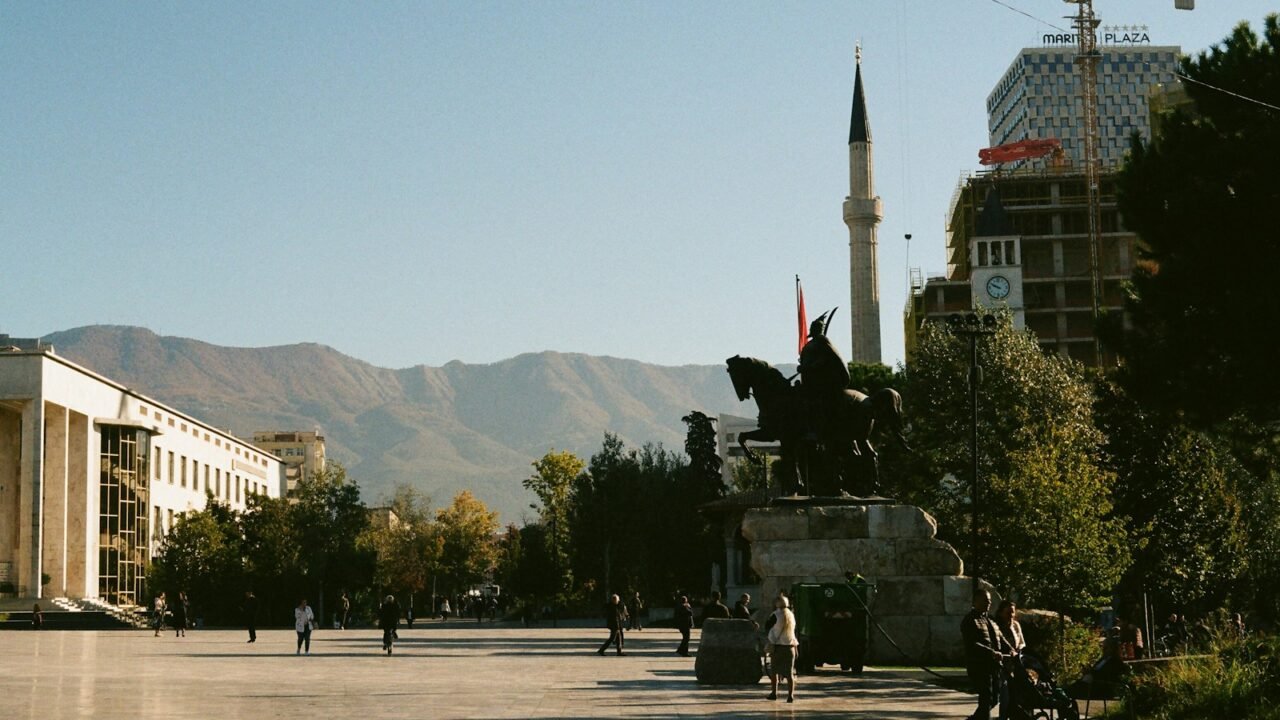 a statue of a man on a horse in the middle of a street