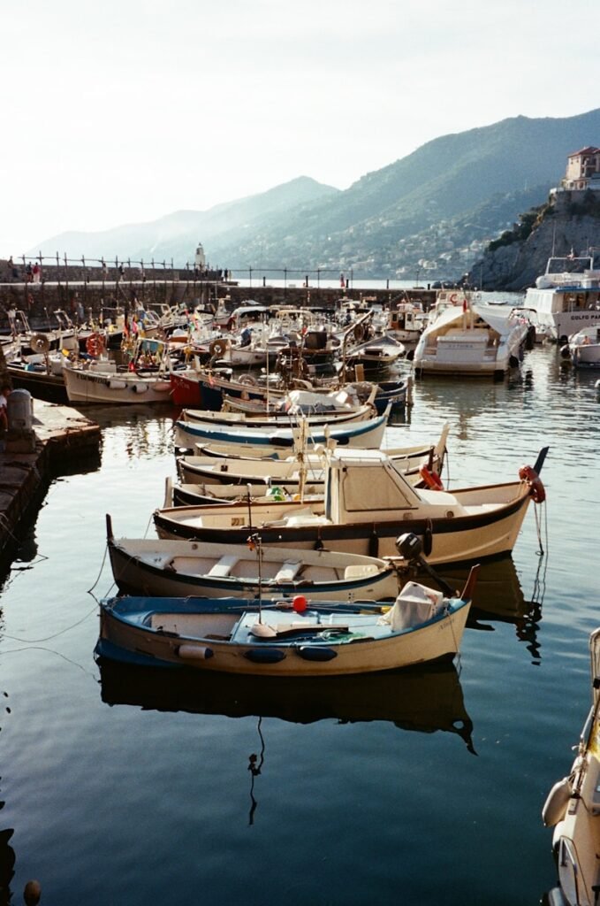 Boats peacefully docked in a serene harbor.